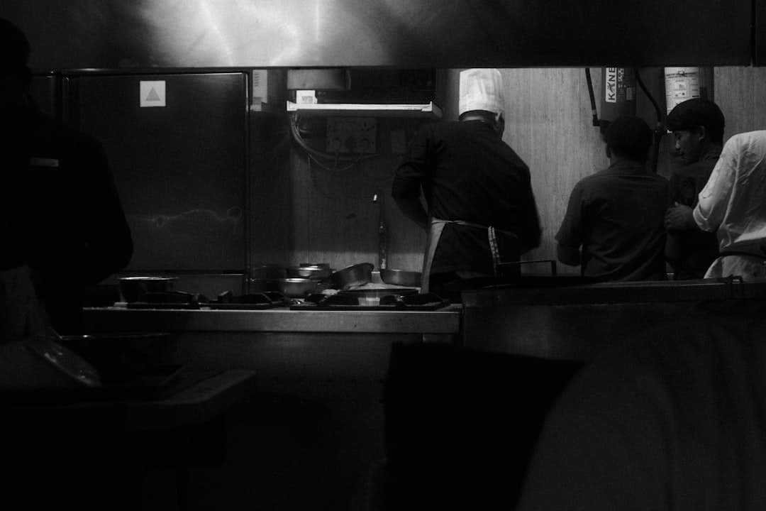 Chefs working in a busy restaurant kitchen
